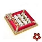 Barfis in a Red Tray with Diya