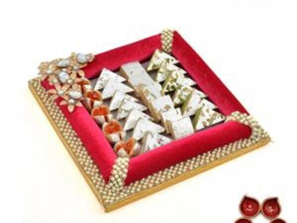 Barfis in a Red Tray with Diya